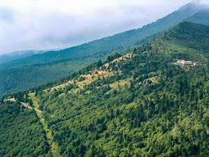 The Mount Mitchell Restaurant is perched above forest and open fields below.